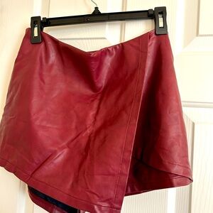 Red faux leather skort